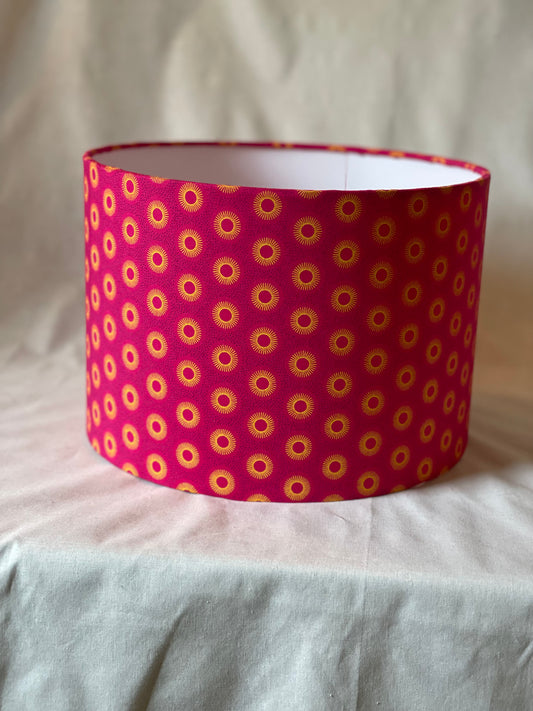10 inch Drum Lampshade. Dynamic South African Shwe Shwe Print- Hot Pink with Golden Yellow Sun Motif.