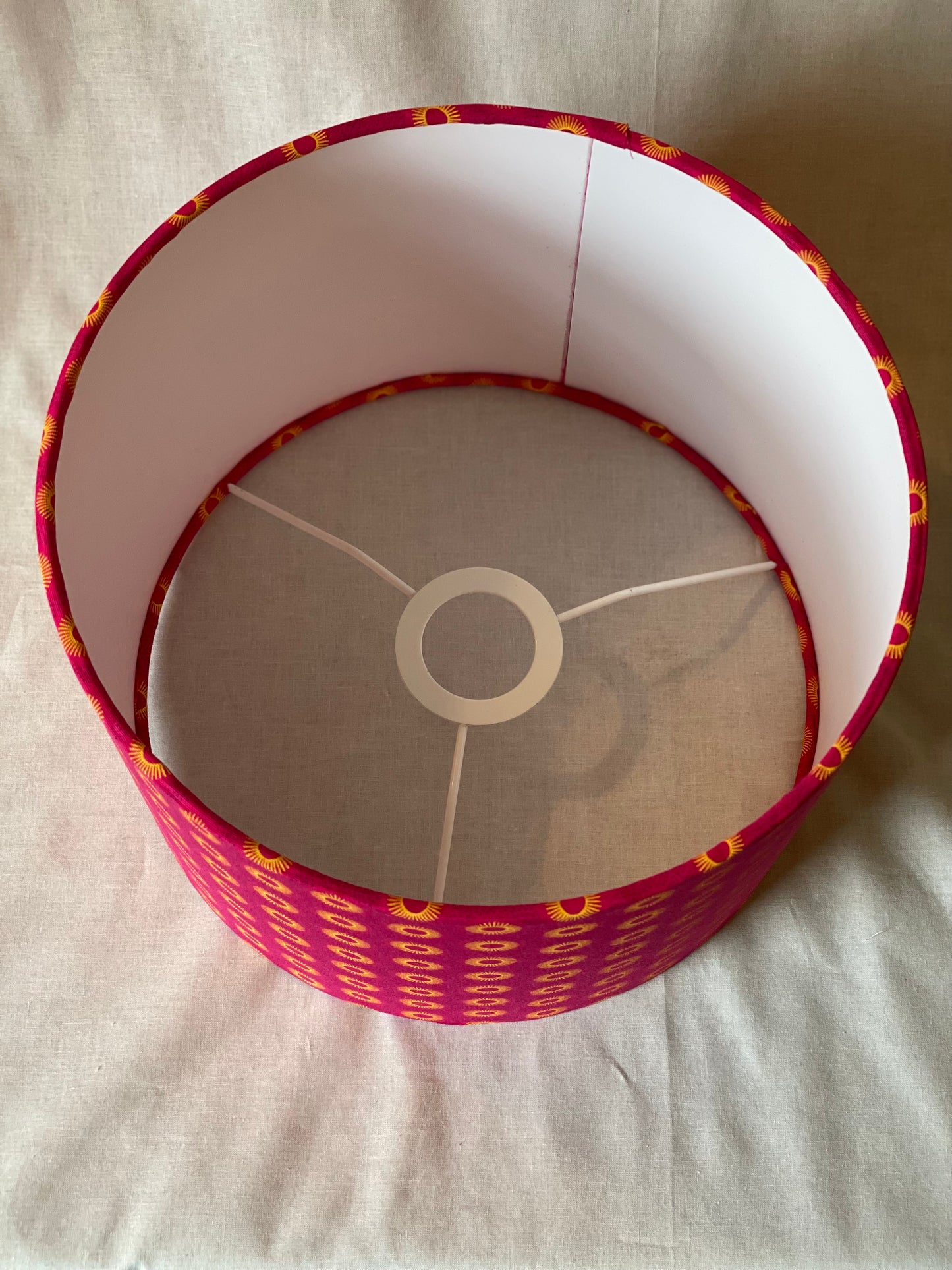 10 inch Drum Lampshade. Dynamic South African Shwe Shwe Print- Hot Pink with Golden Yellow Sun Motif.