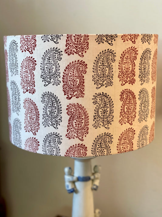 12 inch Drum Lampshade. Bagh Indian Hand Block. Bagh Indian Hand Block. Ecru with Maroon and Black Fancy Paisley Motif.