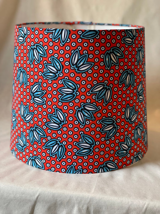 Medium Empire Shade. West African Ankara Fabric. Bright Red with Blue and White Floral and Circular Detail.