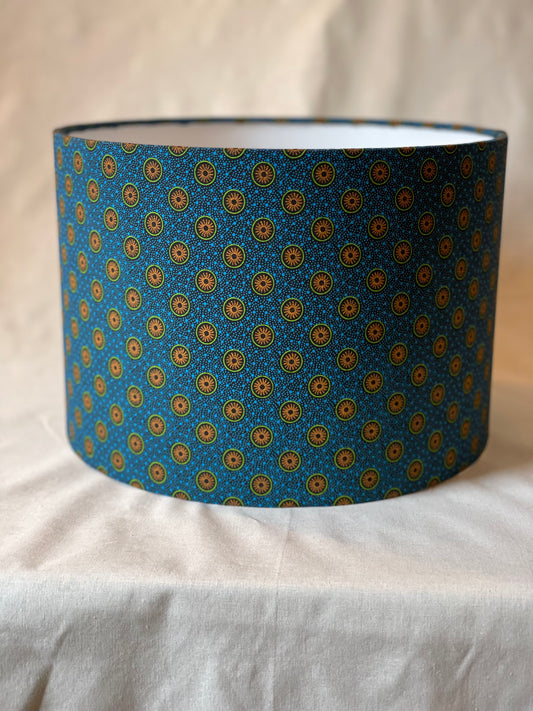 10 inch Drum Lampshade. Dynamic South African Shwe Shwe Print- Navy Blue with Orange and Green Medallion and Tiny Blue Dots.