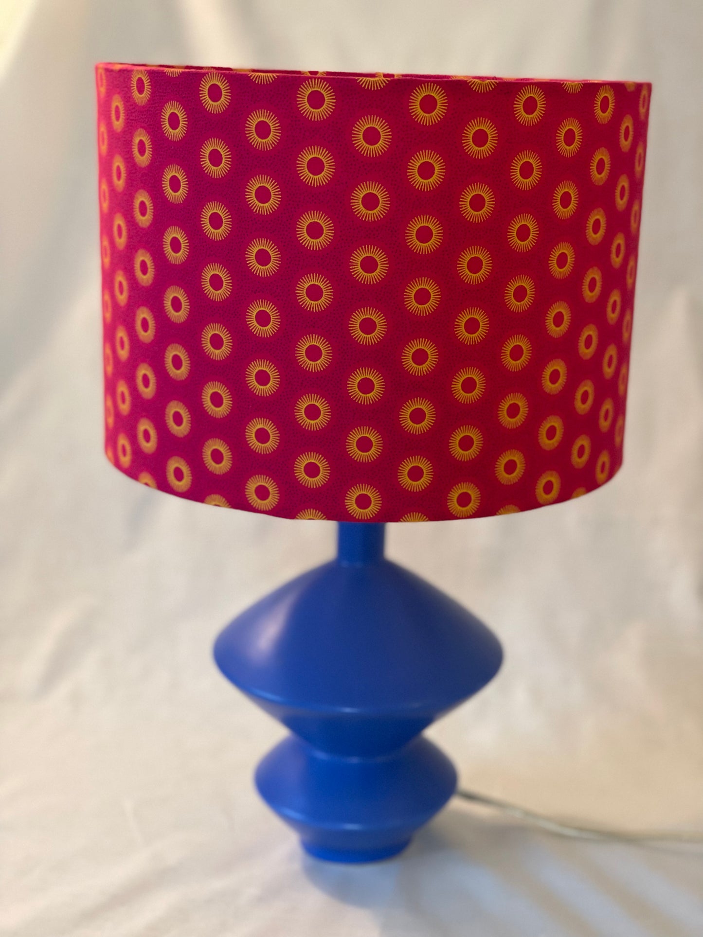 10 inch Drum Lampshade. Dynamic South African Shwe Shwe Print- Hot Pink with Golden Yellow Sun Motif.