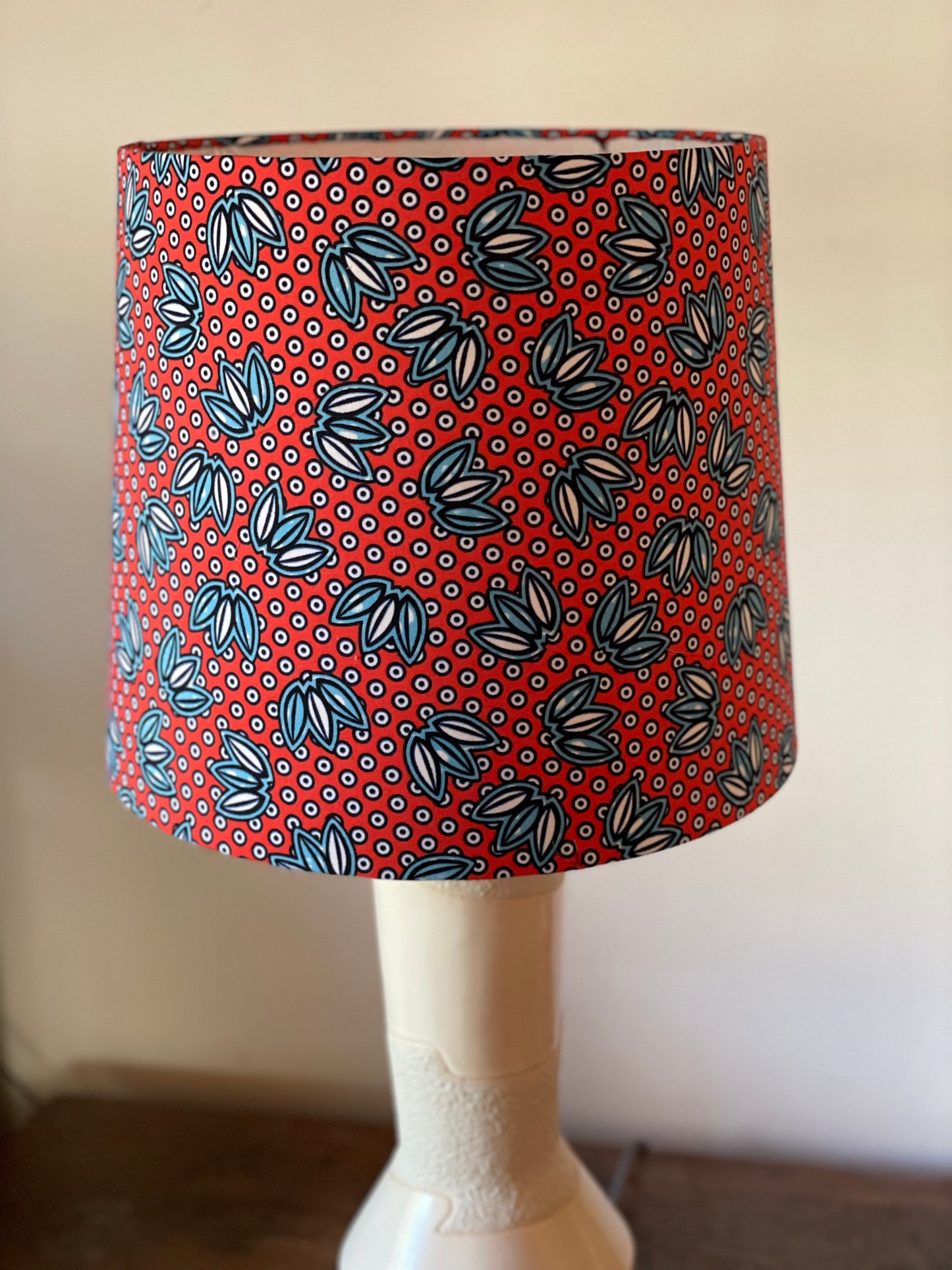 Large Empire Shade. 11.75 x 13.75 x 11.75. West African Ankara Fabric. Bright Red with Blue and White Floral and Circular Detail.