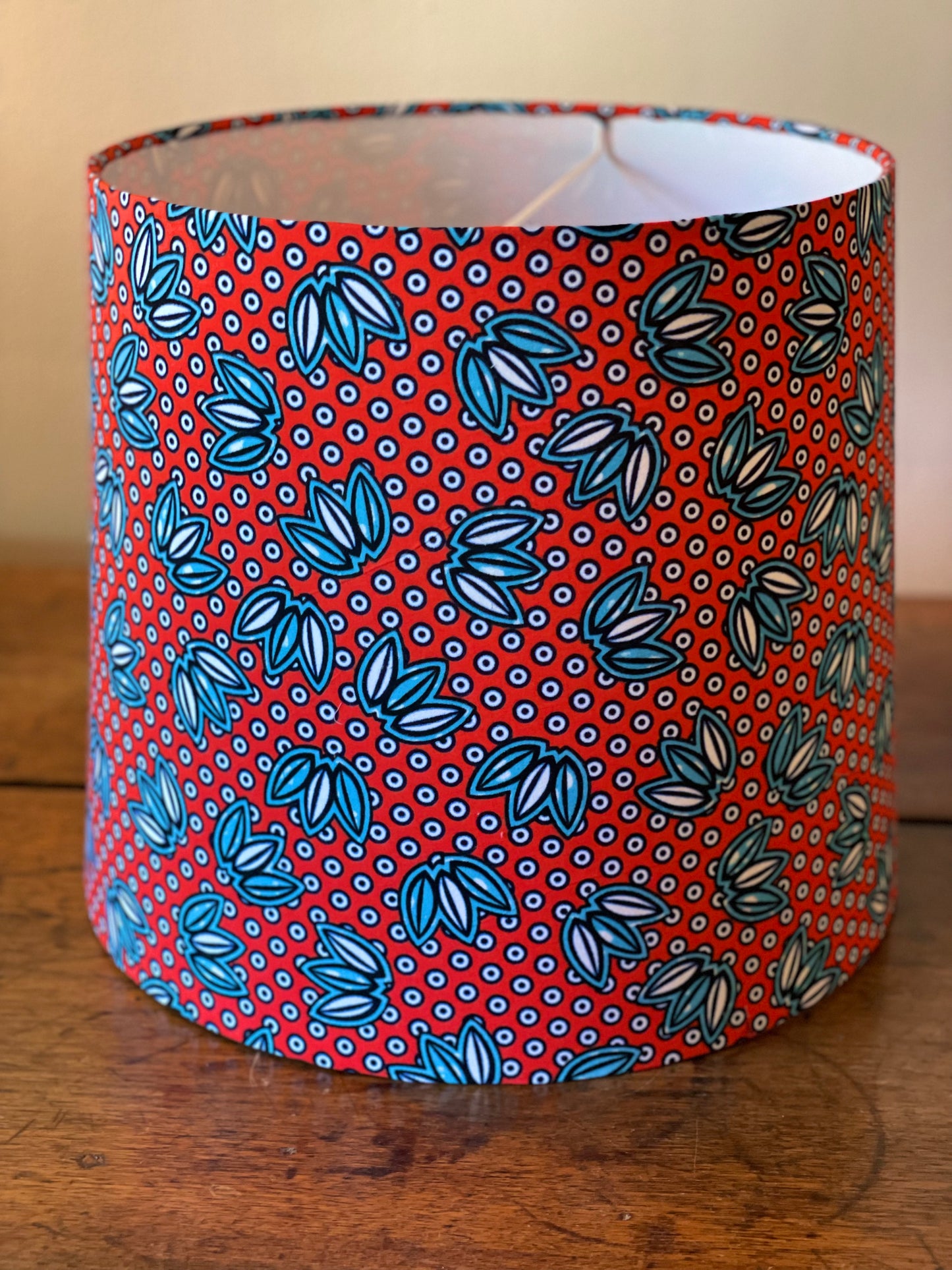 Large Empire Shade. 11.75 x 13.75 x 11.75. West African Ankara Fabric. Bright Red with Blue and White Floral and Circular Detail.